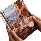 Elite Stationery House 2027 Mazag daily agenda with hard cover, wire binding, and scenic coffee table illustration.