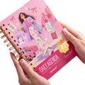 Elite Stationery House 2027 Super Girl daily agenda with pink hard cover, wire binding, and cream paper pages.