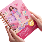 Elite Stationery House 2027 Super Girl daily agenda with pink hard cover, wire binding, and cream paper pages.