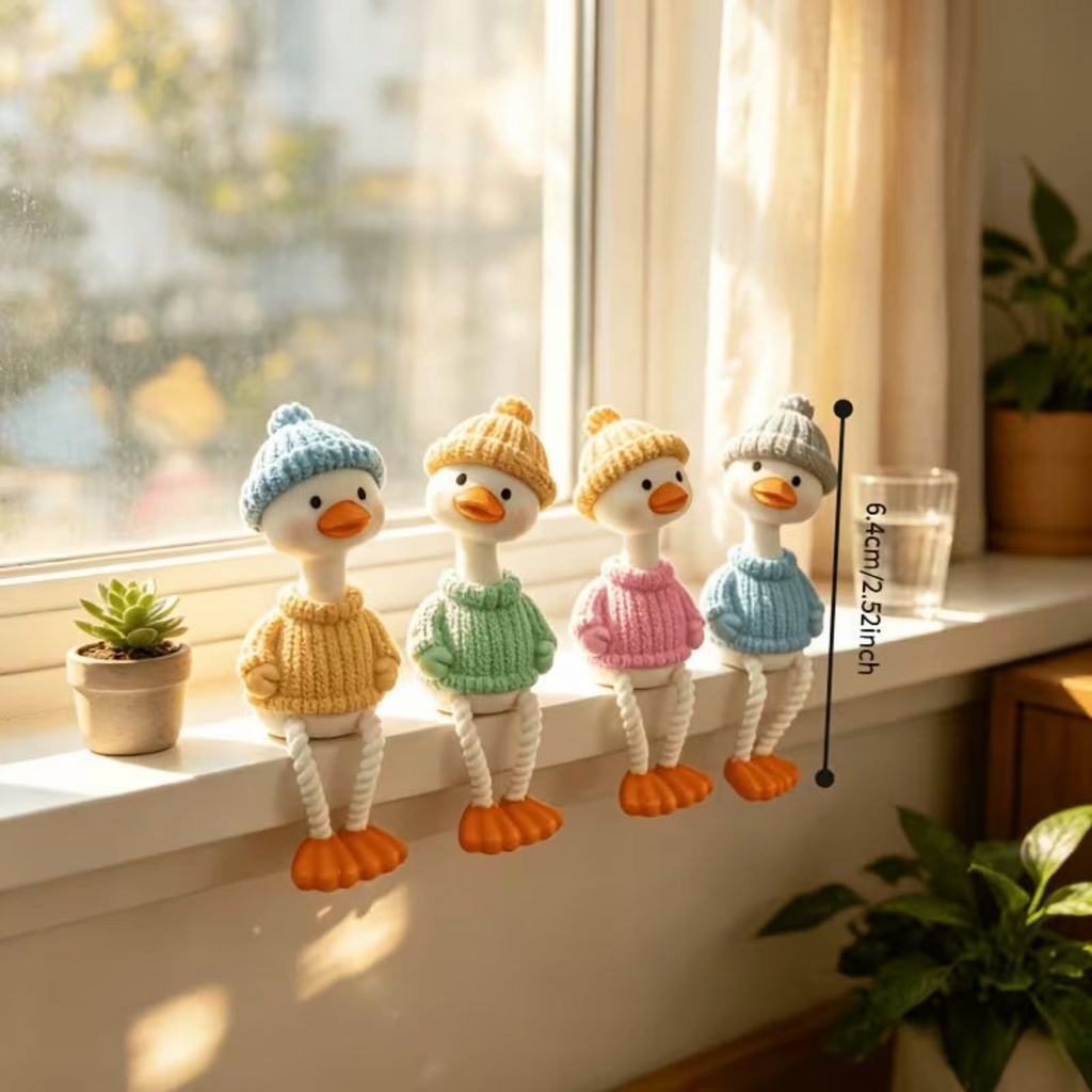 Elite Stationery House set of four long-legged sitting duck figurines wearing colorful knitted sweaters and hats