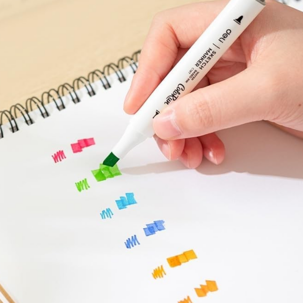 Elite Stationery House Deli double tip sketch marker being used to draw colorful swatches on a sketchbook page