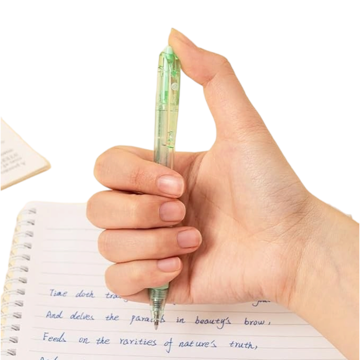 Elite Stationery House 0.7 mm ballpoint pen held in hand writing on a notebook with blue ink