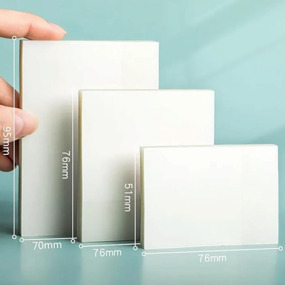 Elite Stationery House transparent waterproof self-adhesive sticky notes in three different sizes held by a hand