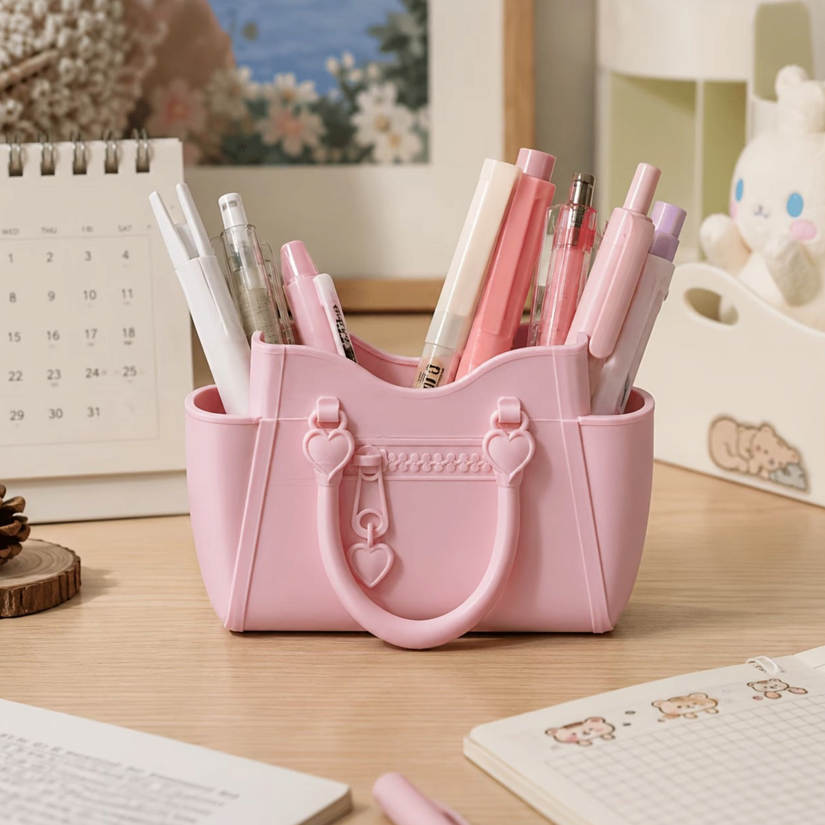 Elite Stationery House 3D printed pink handbag-shaped pen holder filled with various pens on a white background