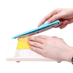 Elite Stationery House A6 manual guillotine paper cutter with a blue handle and finger guard trimming yellow paper