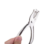 Elite Stationery House silver Deli 1-hole puncher with a heavy-duty metal design held in a hand