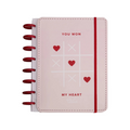 Elite Stationery House Talia A5 hardcover notebook in pale pink with a red tic-tac-toe heart print and disc binding.