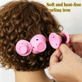 Elite Stationery House 4-piece soft pink silicone no-heat hair curlers being applied to curly hair for styling