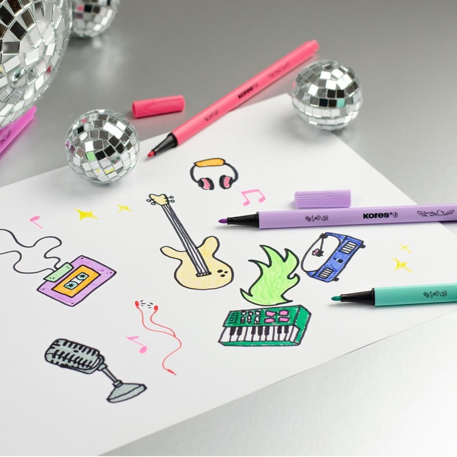 Elite Stationery House Kores K-Beats felt tip pens with vibrant drawings on paper and decorative disco balls