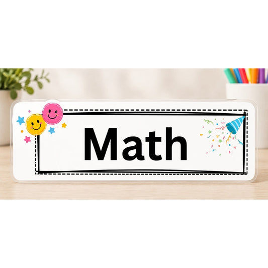 Elite Stationery House laminated Math subject label with smiley face icons and colorful confetti on a wooden desk