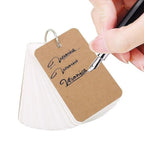 Elite Stationery House multicolor kraft paper study cards with a metal binder ring being written on with a fountain pen