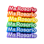 Elite Stationery House personalized 3D-printed name tags in a rainbow stack of red, orange, yellow, green, blue, purple